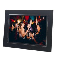 black and silver photo mount with photo of women dancing at a party