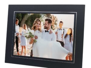 black and silver photo mount with photo of bride and groom at their wedding